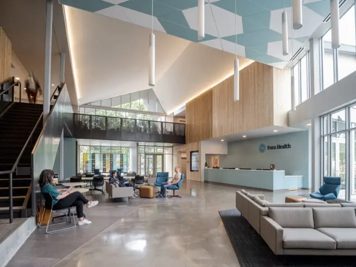 A view of Fora Health’s bright and airy lobby toward the front door.