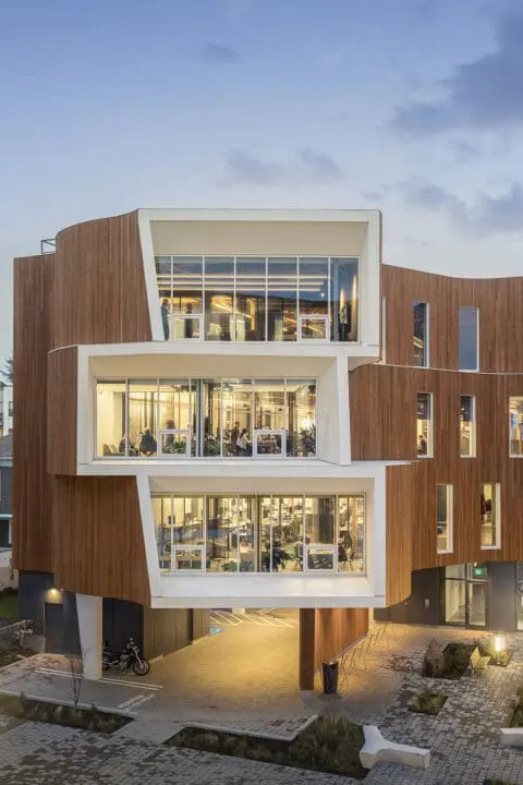 An exterior view level with the third floor looks into the offices through the floor-to-ceiling window apertures of One North.